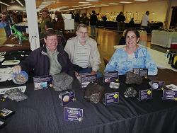 Wayne, RJ and Anita exhibiting a few meteorites at a local show